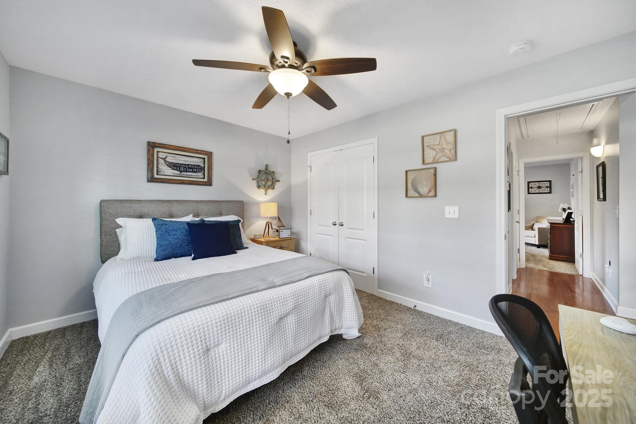 2045 Roadrunner Road Clover, SC 29710 - Photo 21 of 38 a bedroom with a bed and a chandelier