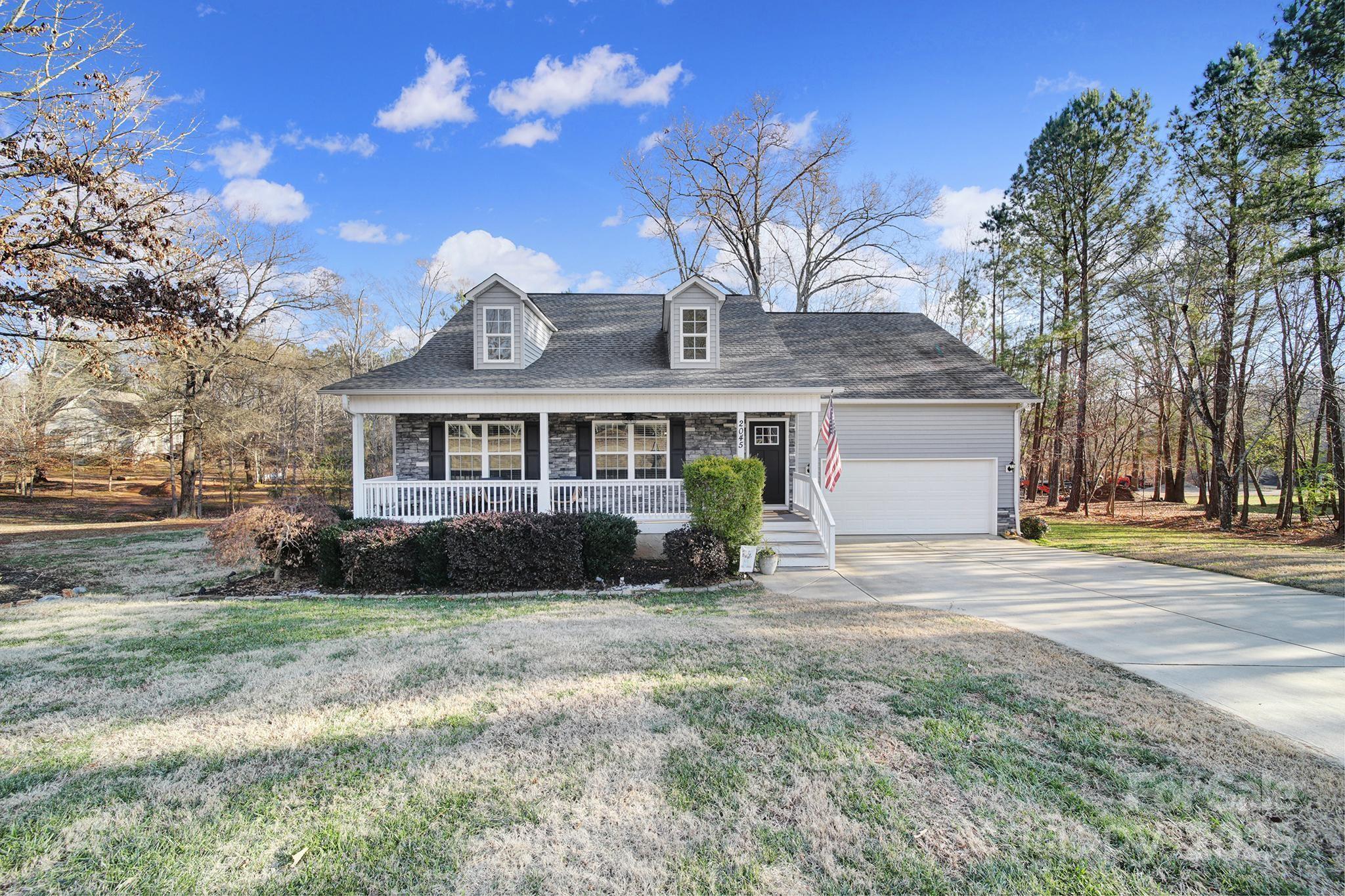 2045 Roadrunner Road Clover, SC 29710 - Photo 30 of 38 a front view of a house with a yard and garage