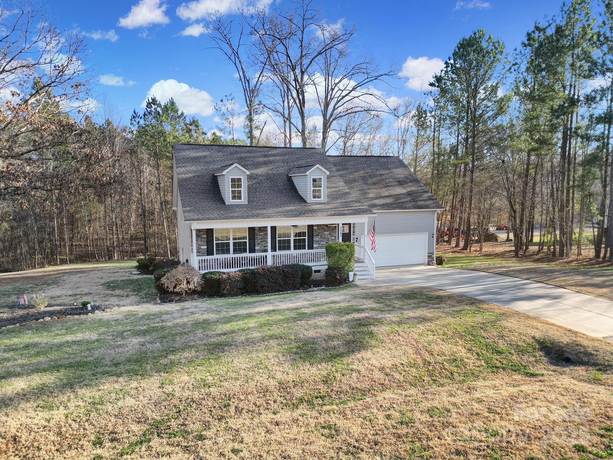 2045 Roadrunner Road Clover, SC 29710 - Photo 32 of 38 a view of a house with a yard covered with snow in the background