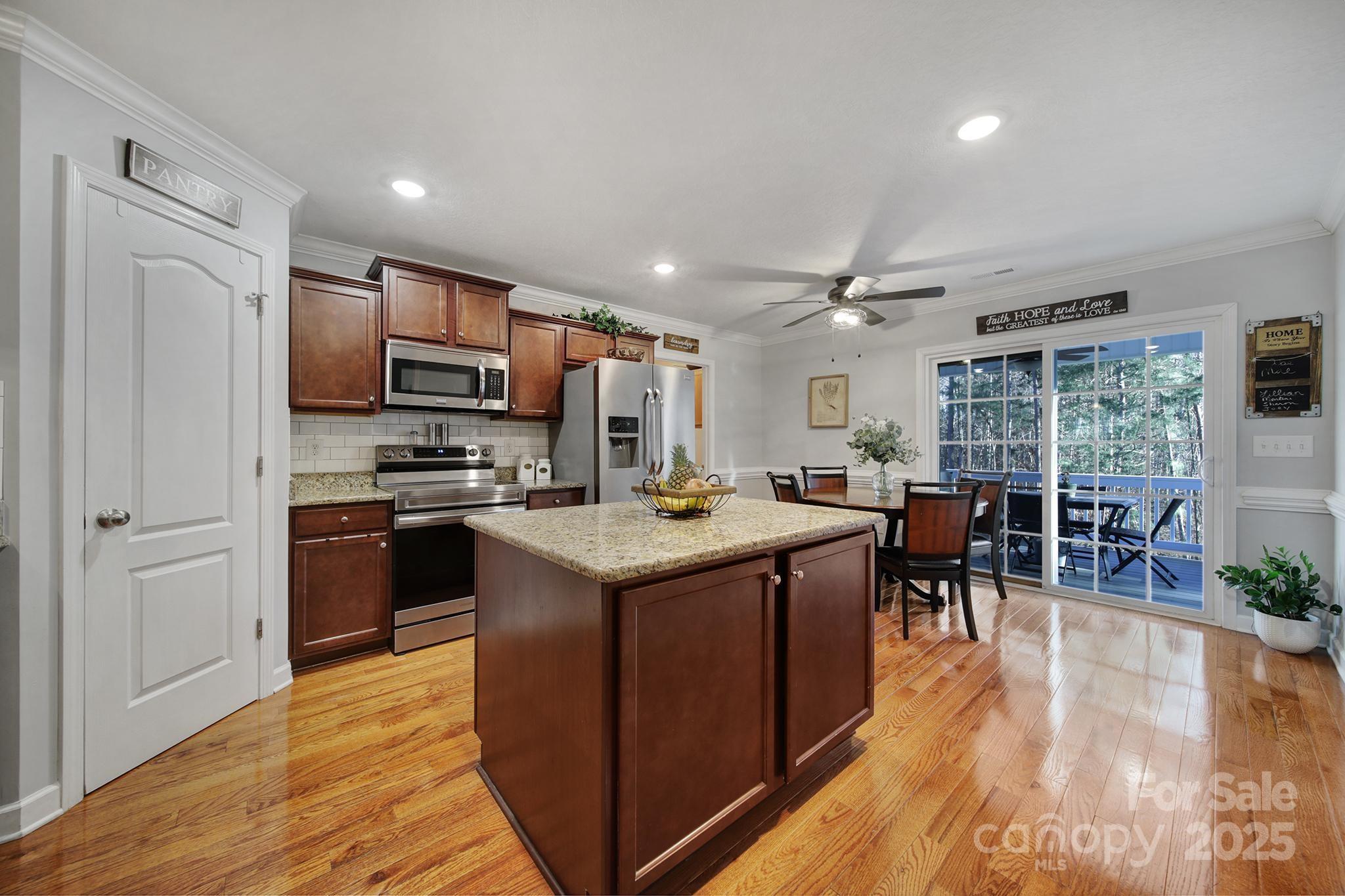 2045 Roadrunner Road Clover, SC 29710 - Photo 5 of 38 a kitchen with stainless steel appliances granite countertop a stove and a refrigerator