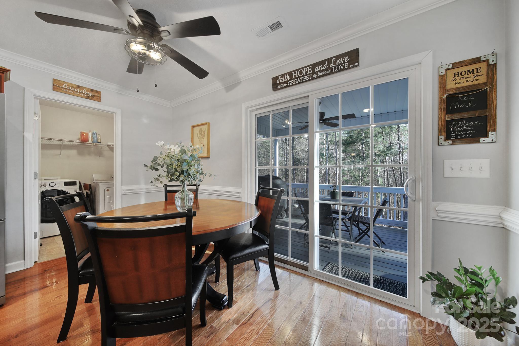 2045 Roadrunner Road Clover, SC 29710 - Photo 8 of 38 a view of a dining room with furniture window and wooden floor
