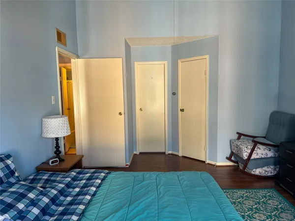 a bedroom with furniture and a window