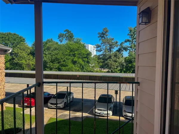 a view of swimming pool from a balcony