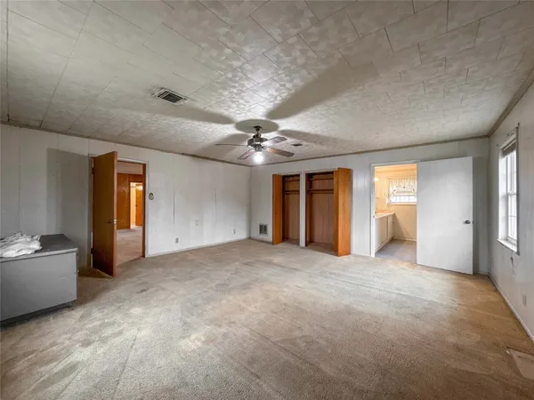 a view of an empty room and window