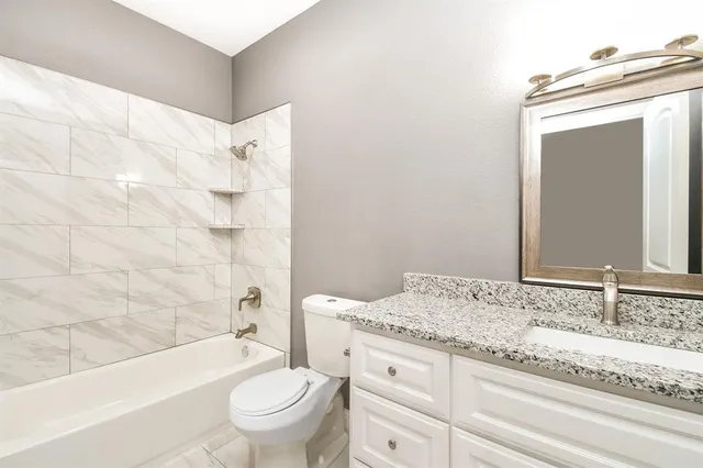 a bathroom with a sink a mirror and shower