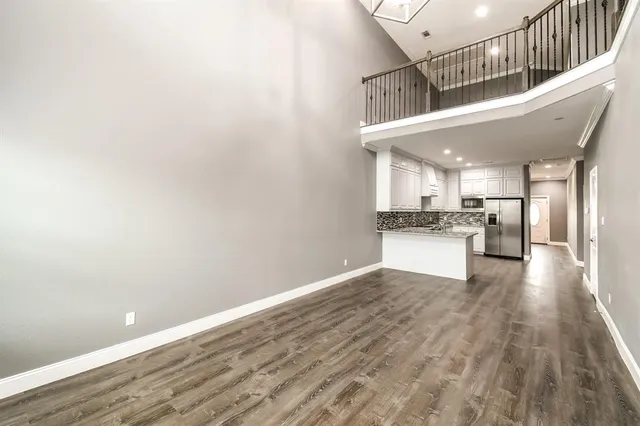 a view of kitchen with cabinets and wooden floor