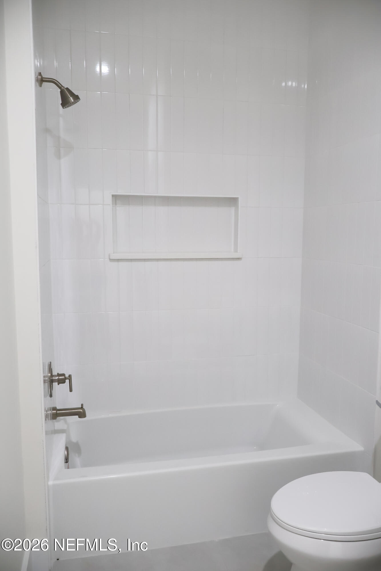 261121 Rowe Road Hilliard, FL 32046 - Photo 26 of 33 a bathroom with a toilet and a bath tub