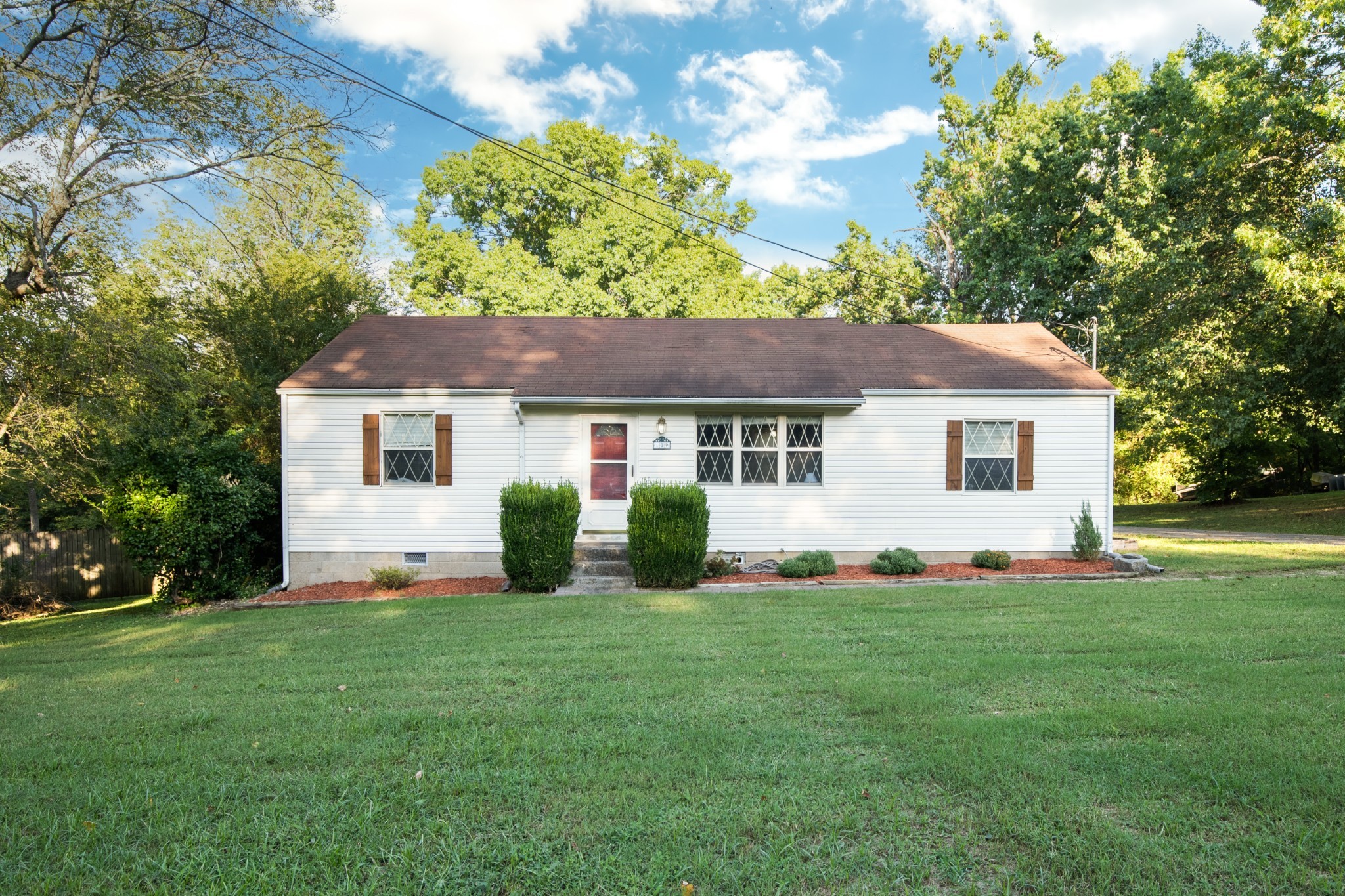 109 Randy Road Madison, TN 37115 - Photo 1 of 31 a front view of a house with a yard and garage