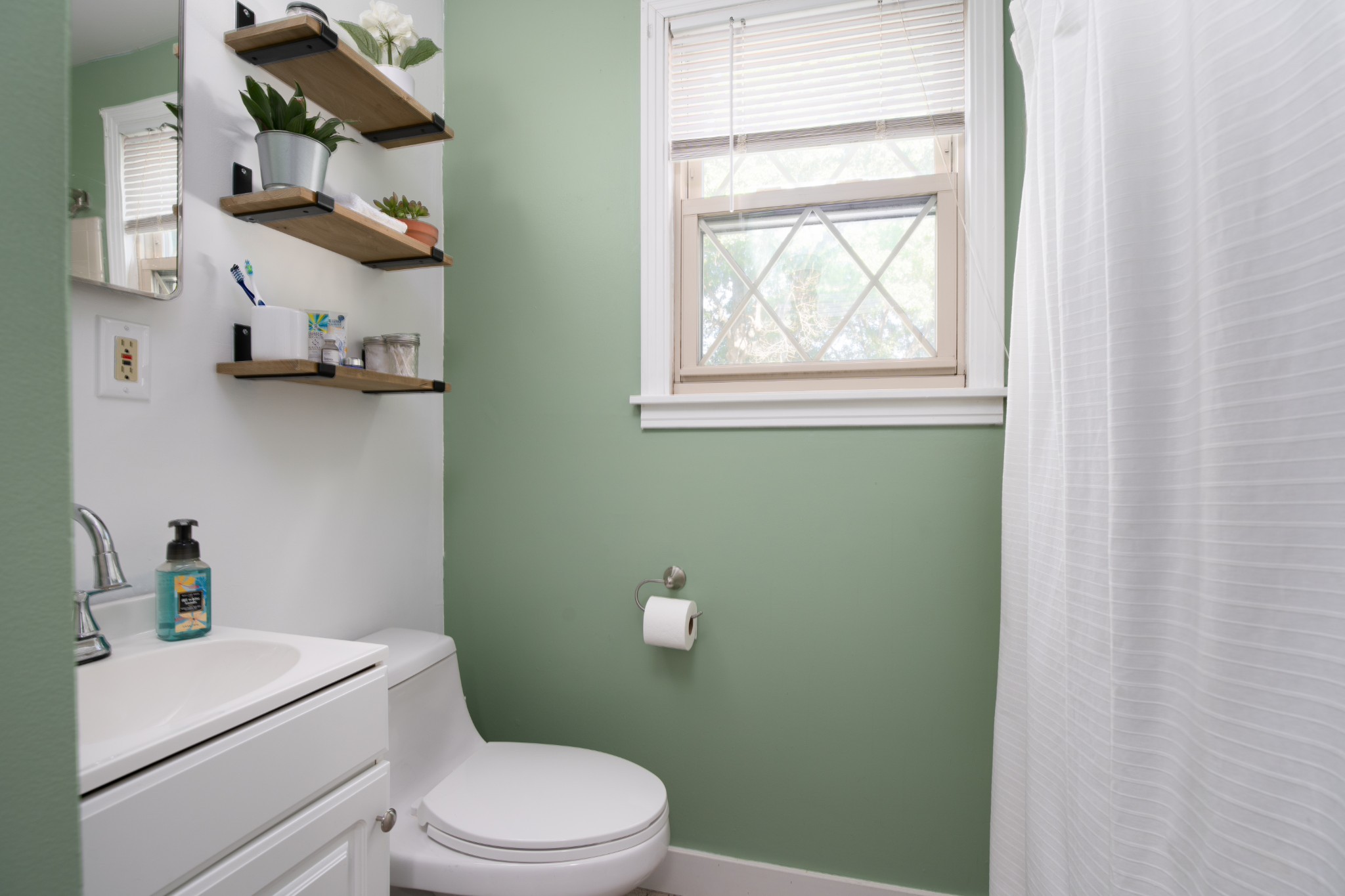 109 Randy Road Madison, TN 37115 - Photo 12 of 31 a bathroom with a toilet sink and window