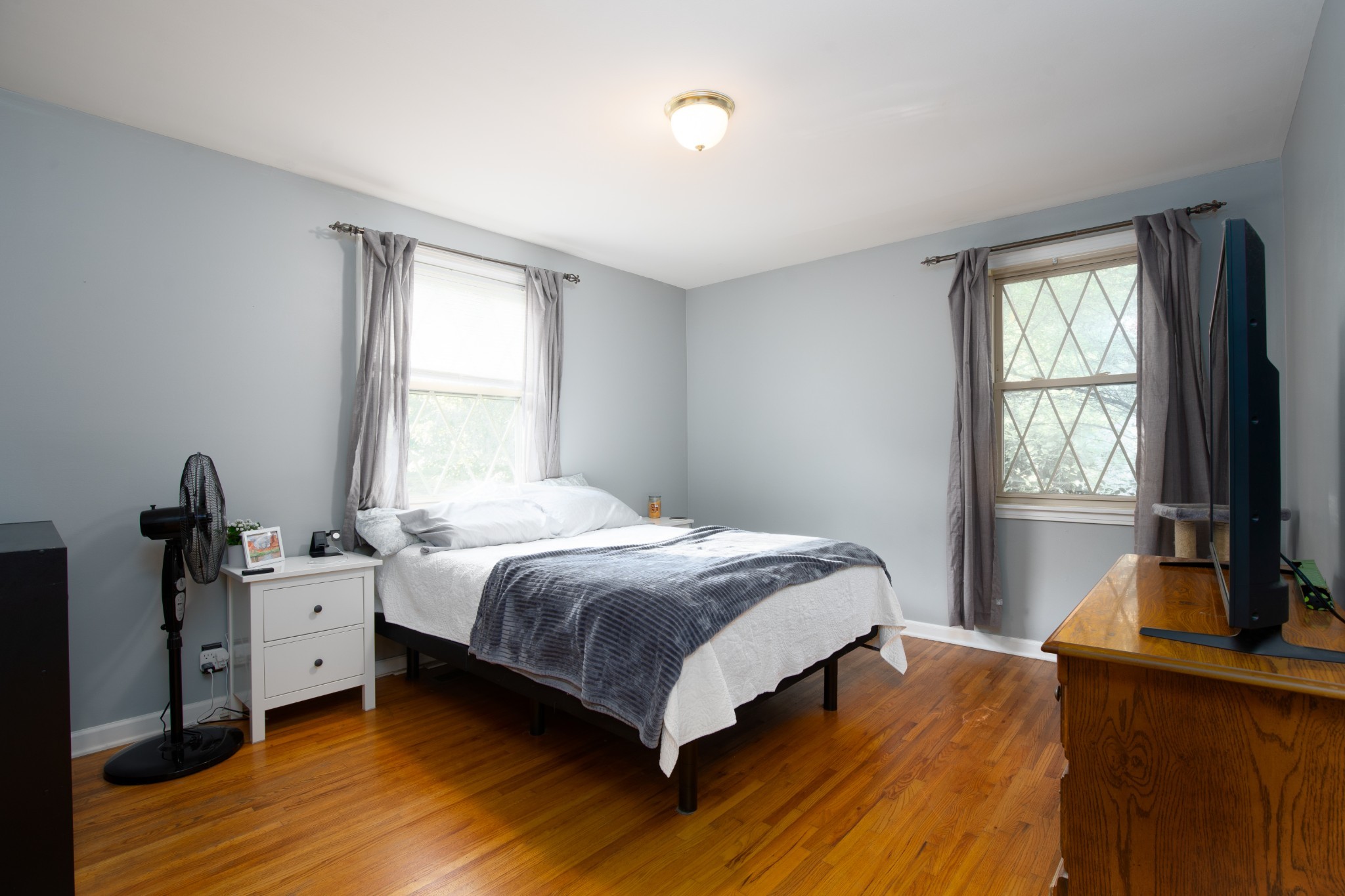 109 Randy Road Madison, TN 37115 - Photo 14 of 31 a bedroom with a bed and a flat tv screen on a dresser