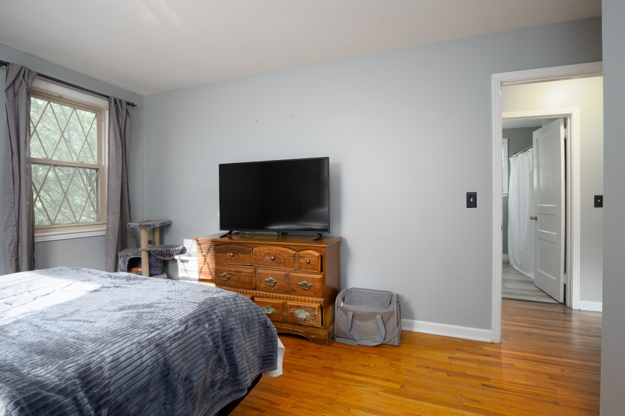 109 Randy Road Madison, TN 37115 - Photo 15 of 31 a bedroom with a bed and wooden floor