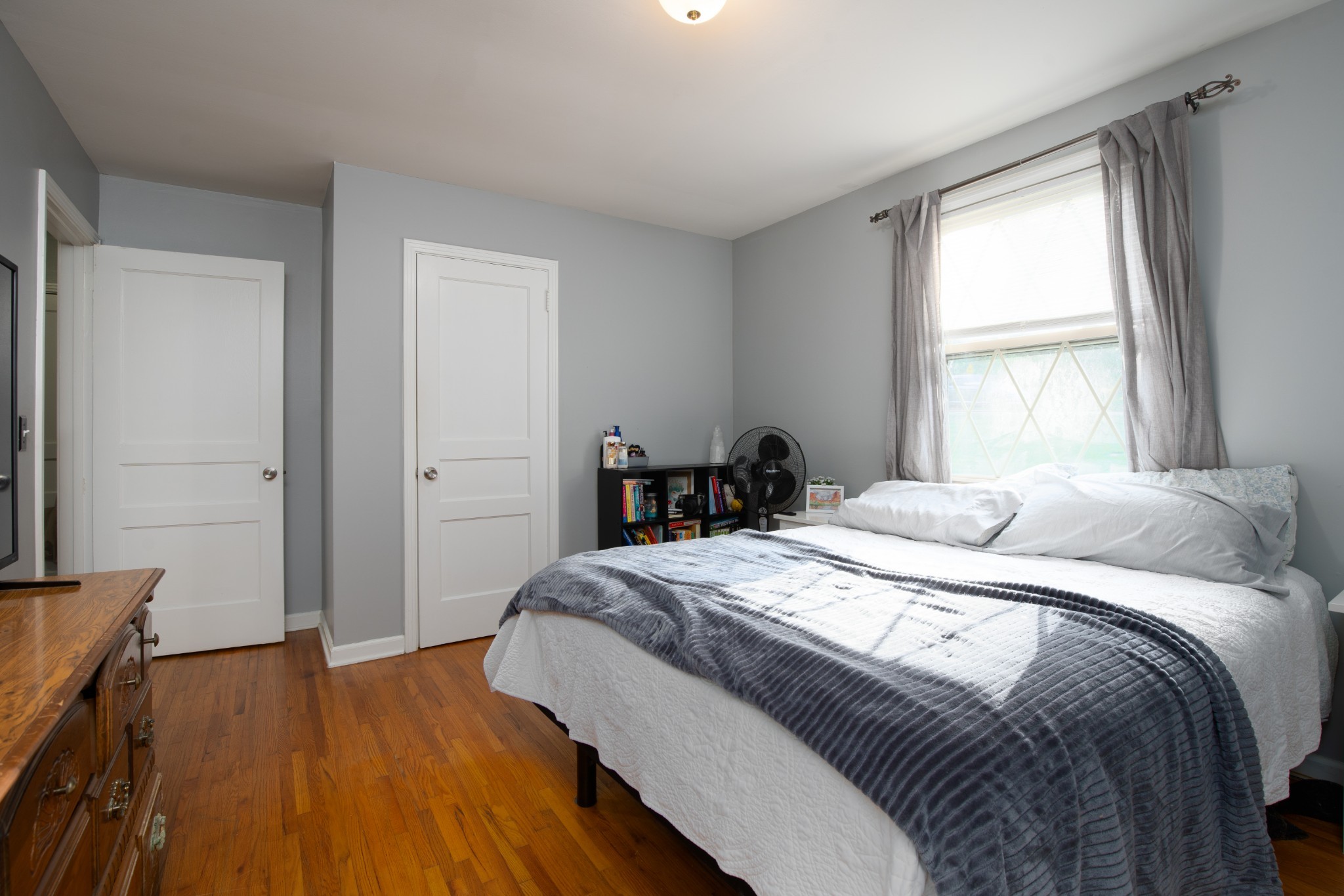109 Randy Road Madison, TN 37115 - Photo 17 of 31 a bedroom with a bed and wooden floor