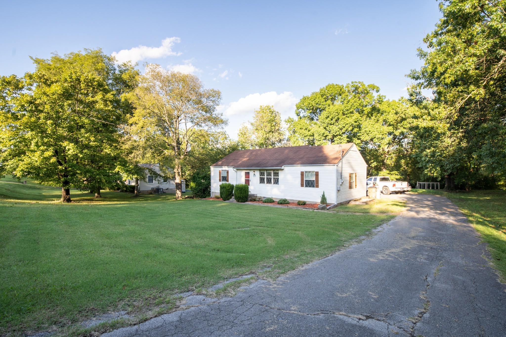109 Randy Road Madison, TN 37115 - Photo 2 of 31 a front view of a house with a garden