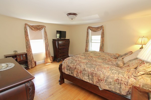 73 Morningside Road Worcester, MA 01602 - Photo 7 of 17 a bedroom with a bed and wooden floor