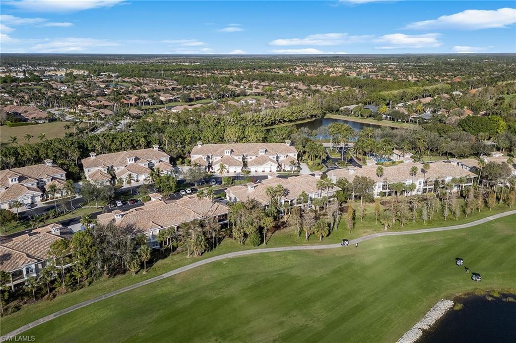 3945 Deer Crossing Court, Unit 203 Naples, FL 34114 - Photo 29 of 50 an aerial view of residential building with outdoor space