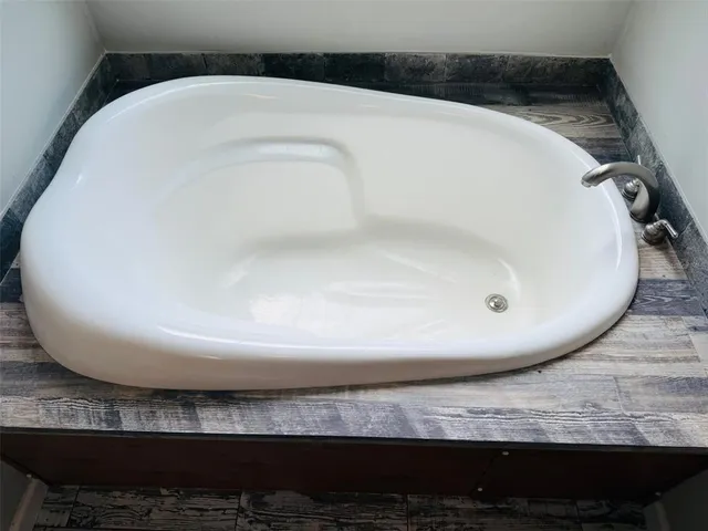 a bathroom with a granite countertop