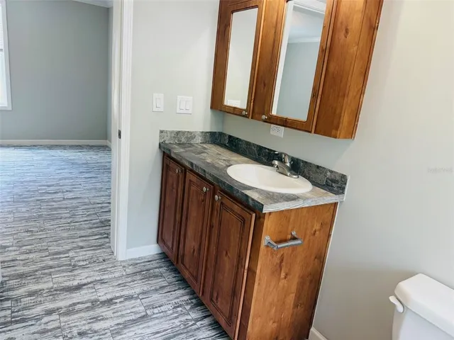 a bathroom with a sink and a mirror