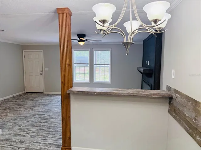 a view of a livingroom with furniture and mirror