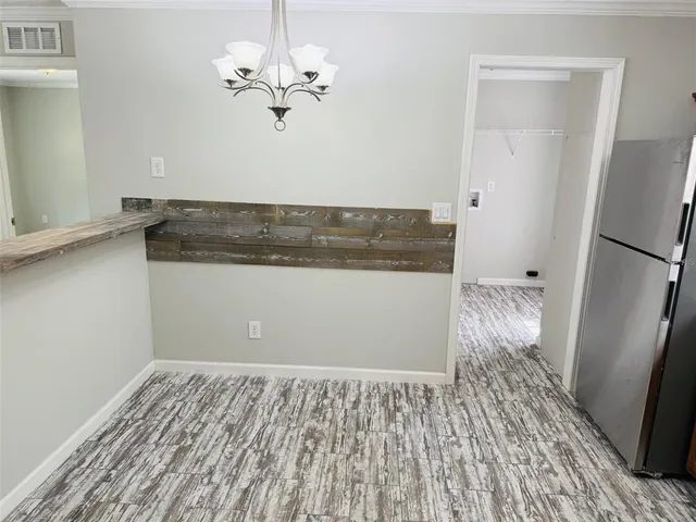 a view of a livingroom with wooden floor