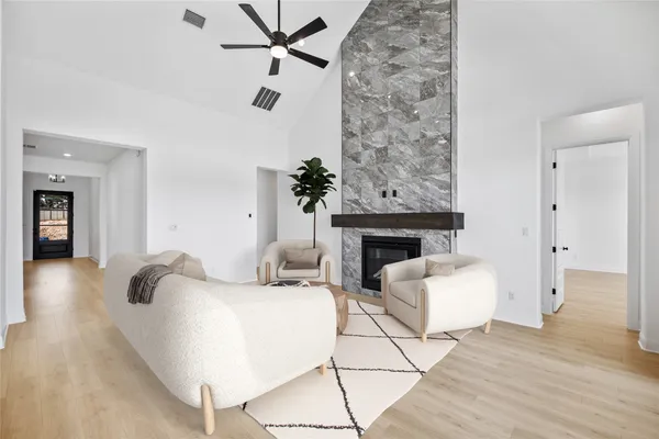 a living room with furniture and a fireplace