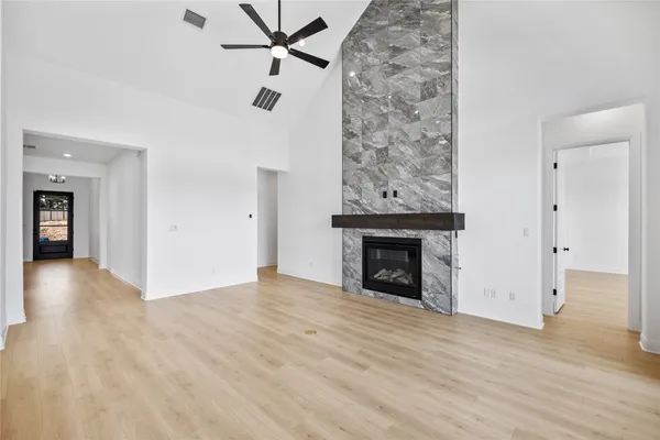 a kitchen with a cabinets and wooden floor