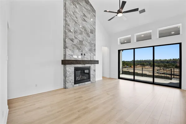 a large kitchen with stainless steel appliances a stove and a refrigerator