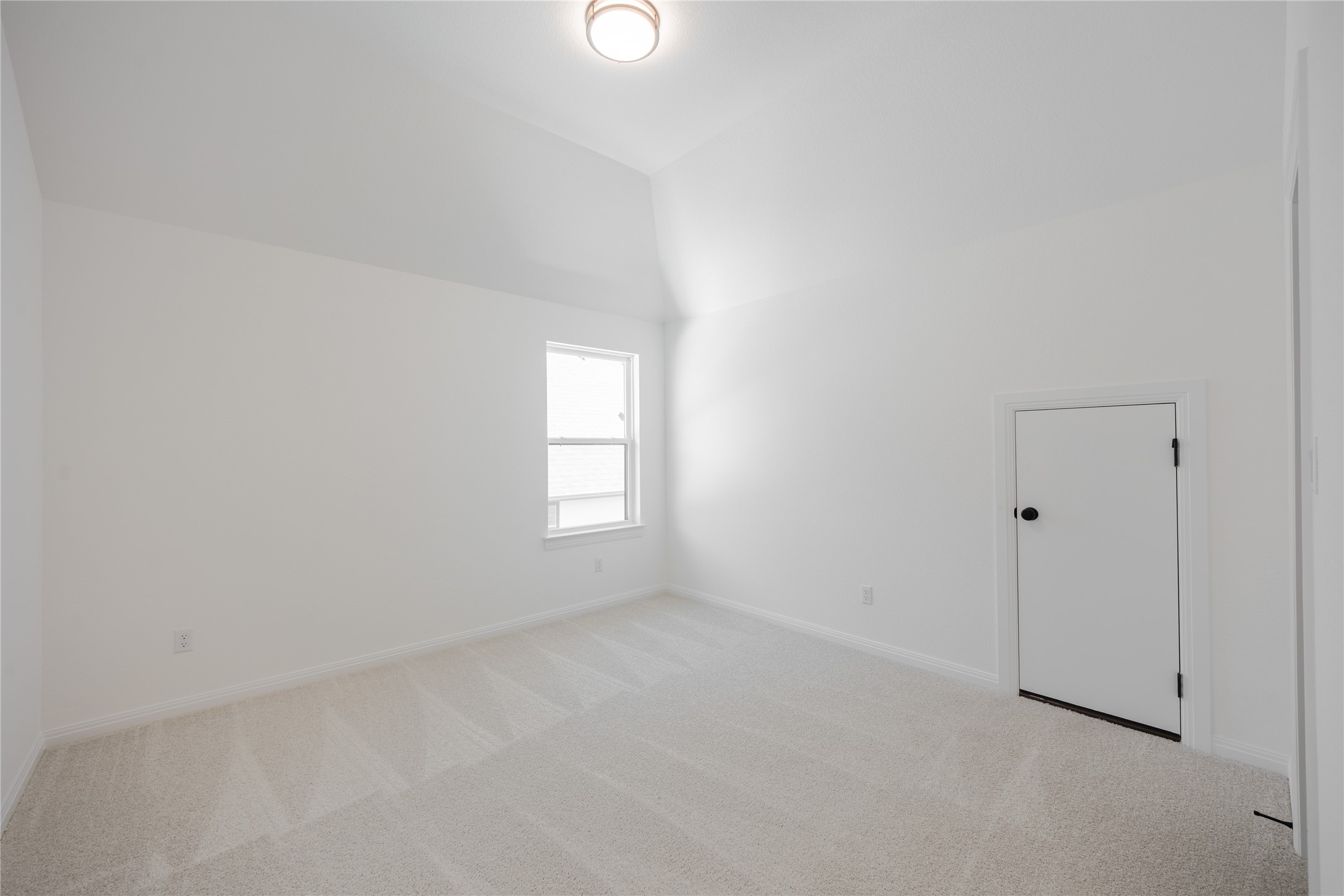3213 Lookout Mountain Road Georgetown, TX 78628 - Photo 25 of 40 Carpeted spare room featuring baseboards and lofted ceiling