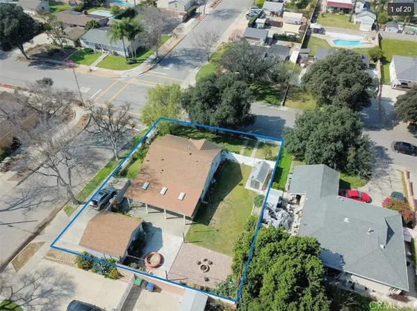 an aerial view of a house with a swimming pool