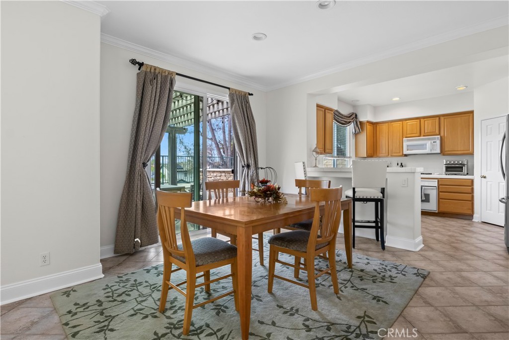 27 Rolling Ridge Rancho Santa Margarita, CA 92688 - Photo 11 of 42 a view of a dining room with furniture and a window