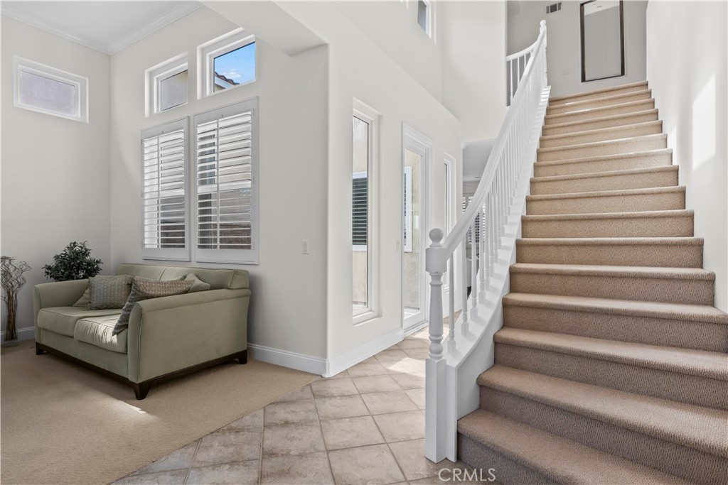 27 Rolling Ridge Rancho Santa Margarita, CA 92688 - Photo 16 of 42 a living room with furniture and stairs