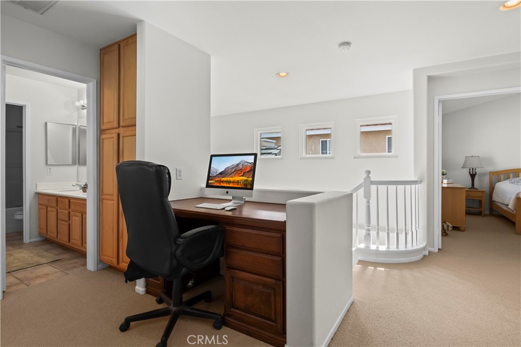 27 Rolling Ridge Rancho Santa Margarita, CA 92688 - Photo 18 of 42 a view of a workspace with furniture and a window