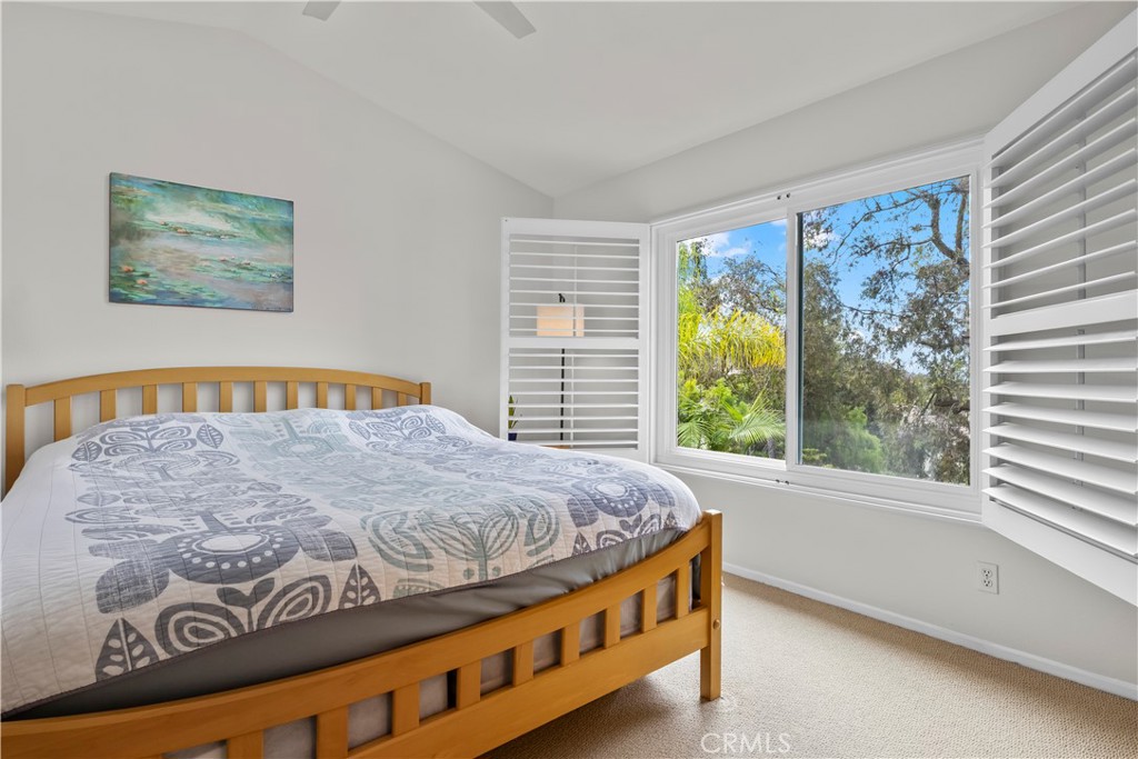 27 Rolling Ridge Rancho Santa Margarita, CA 92688 - Photo 19 of 42 a bedroom with a bed and a large window