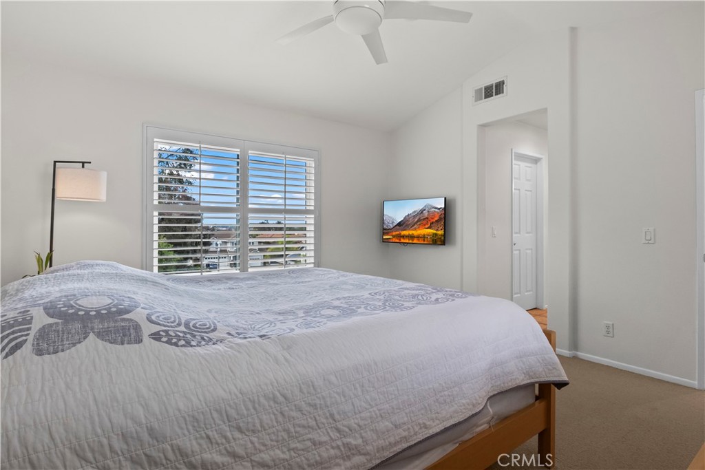 27 Rolling Ridge Rancho Santa Margarita, CA 92688 - Photo 21 of 42 a bedroom with a bed and a window