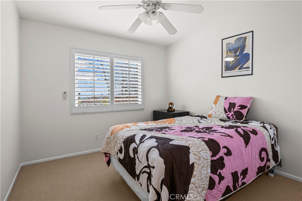 27 Rolling Ridge Rancho Santa Margarita, CA 92688 - Photo 25 of 42 a bedroom with a bed and a window