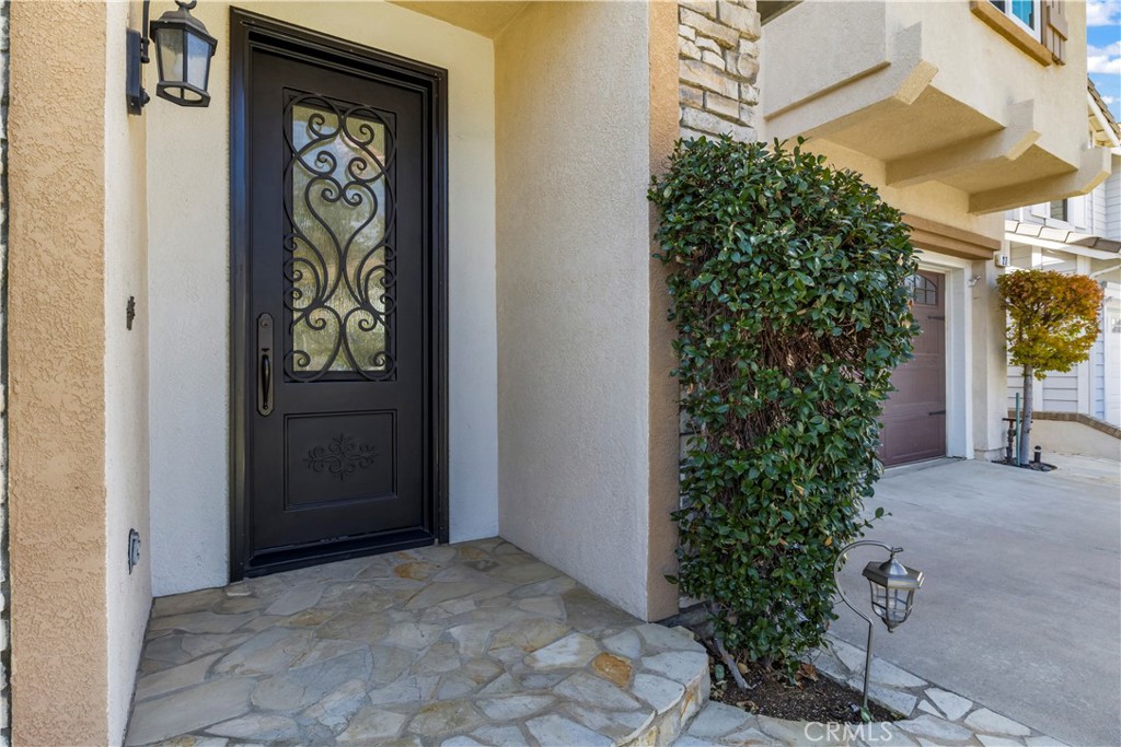 27 Rolling Ridge Rancho Santa Margarita, CA 92688 - Photo 3 of 42 a sign that is in front of a door