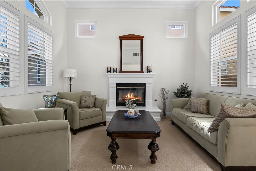 27 Rolling Ridge Rancho Santa Margarita, CA 92688 - Photo 5 of 42 a living room with furniture and a fireplace