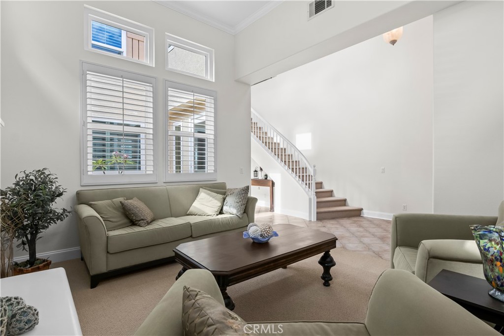 27 Rolling Ridge Rancho Santa Margarita, CA 92688 - Photo 6 of 42 a living room with furniture and a large window