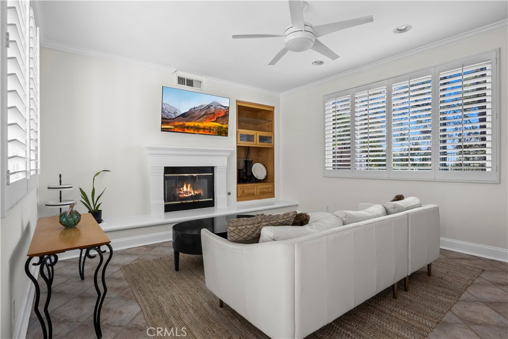 27 Rolling Ridge Rancho Santa Margarita, CA 92688 - Photo 8 of 42 a living room with furniture and a fireplace