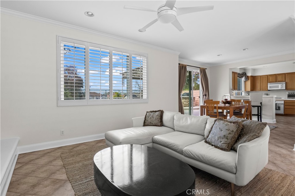 27 Rolling Ridge Rancho Santa Margarita, CA 92688 - Photo 9 of 42 a living room with furniture and a large window