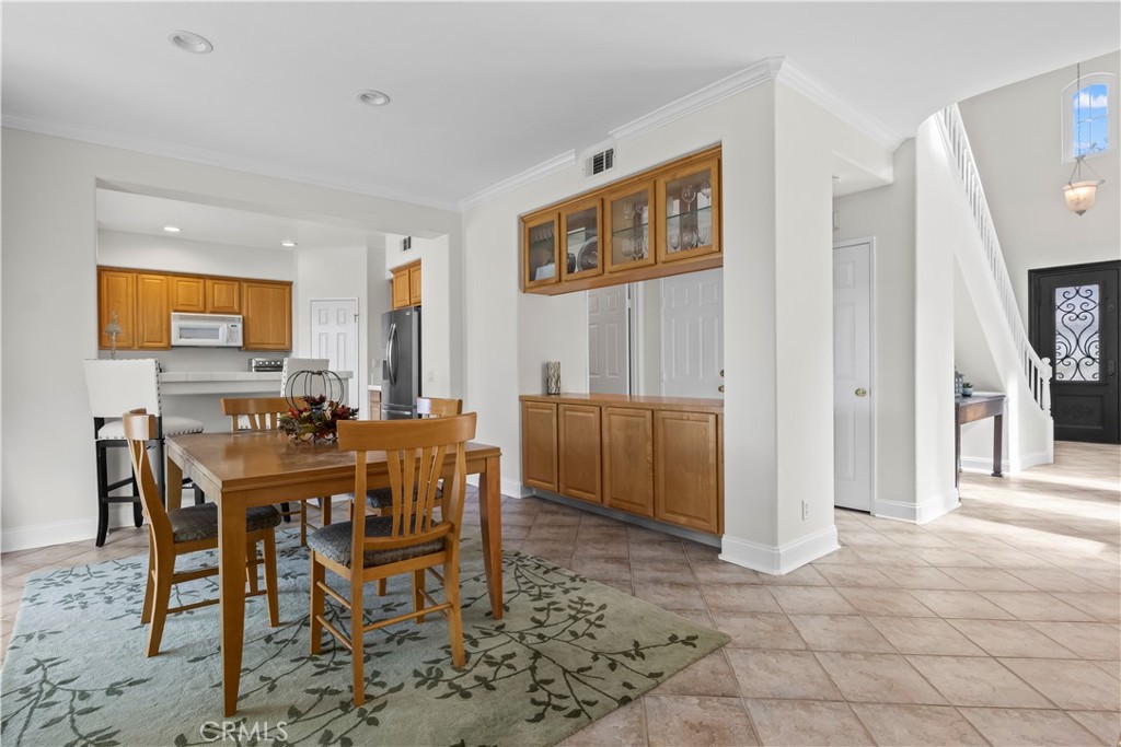 27 Rolling Ridge Rancho Santa Margarita, CA 92688 - Photo 10 of 42 a view of a dining room with furniture