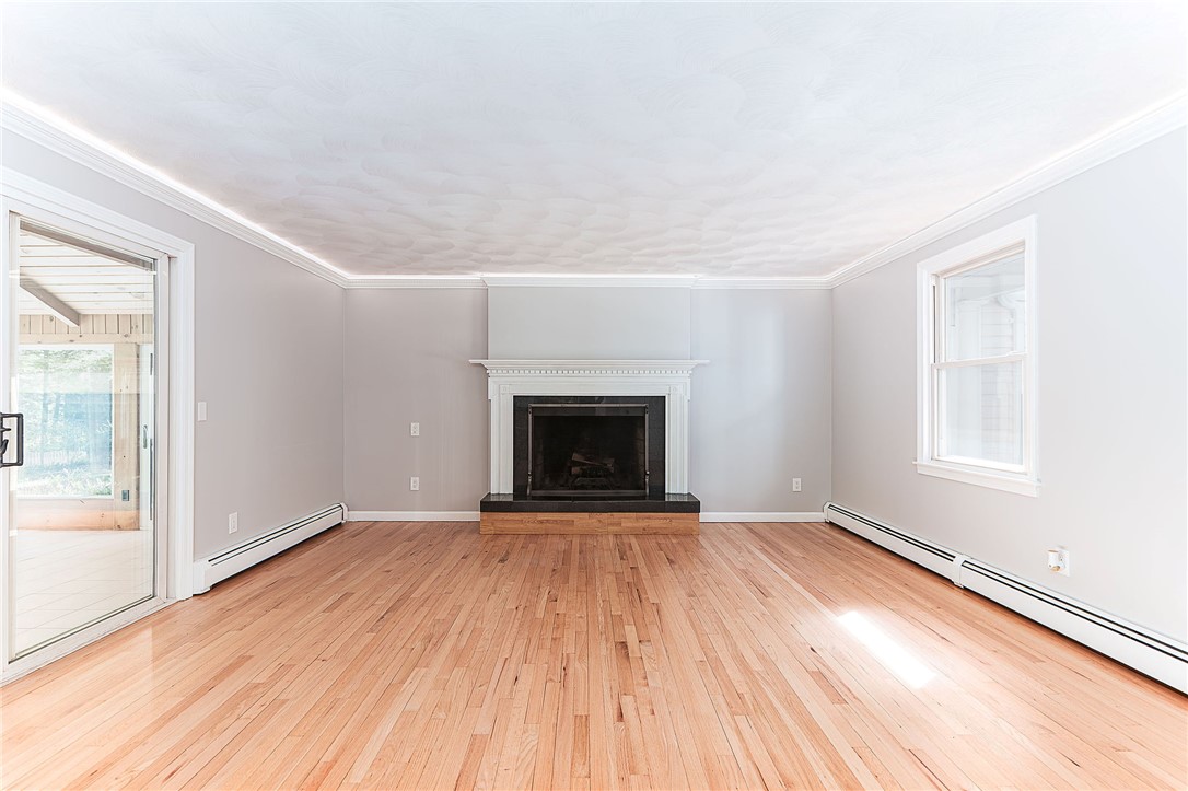 680 Fletcher Road North Kingstown, RI 02852 - Photo 12 of 41 Family room has sliders to 3 season room