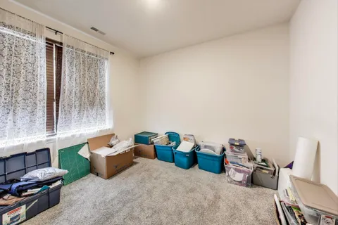 a view of a room with furniture and a window