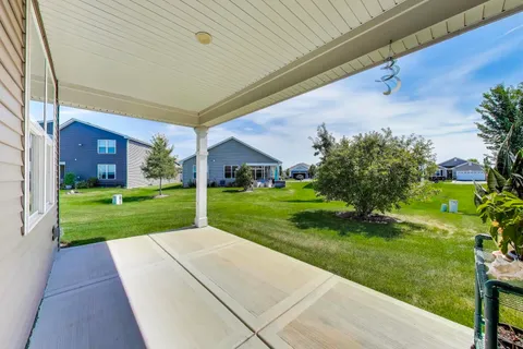 a view of a house with backyard