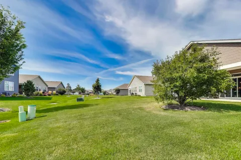a view of a big yard with a house