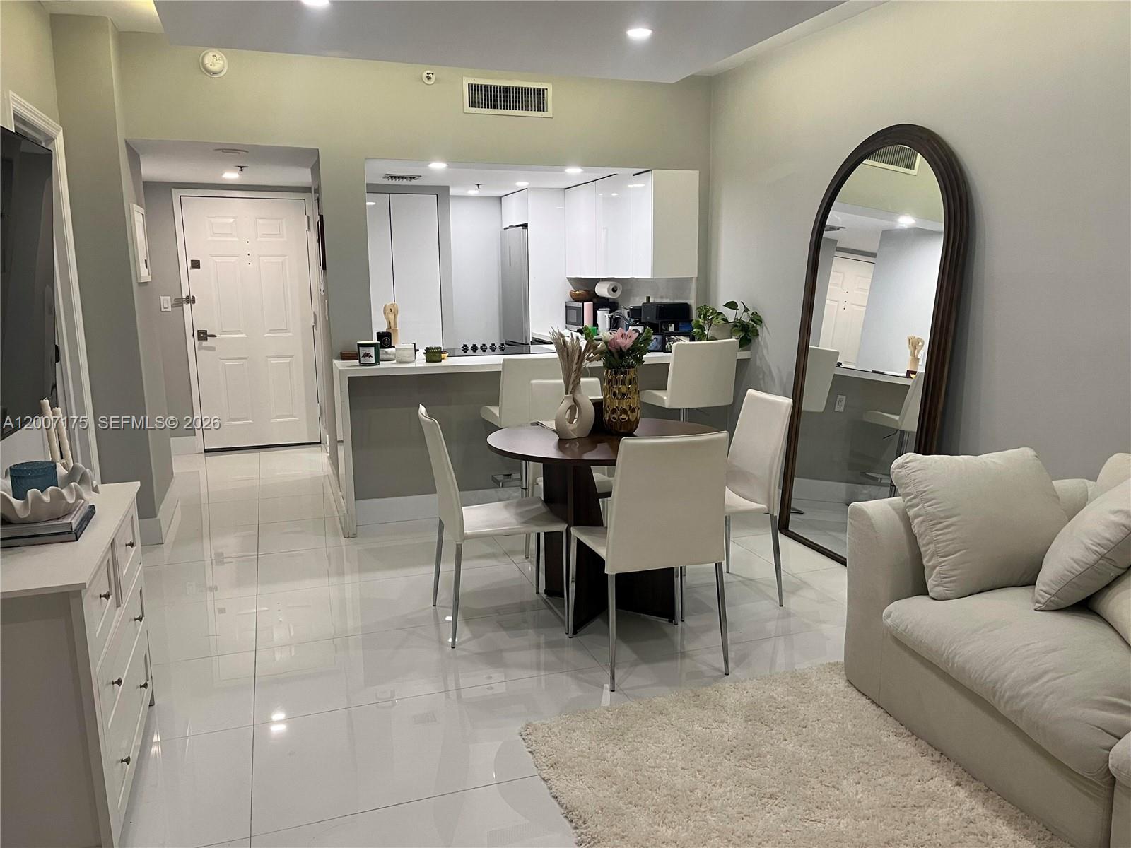 540 Brickell Key Drive, Unit 1809 Miami, FL 33131 - Photo 12 of 25 a view of a dining room with furniture