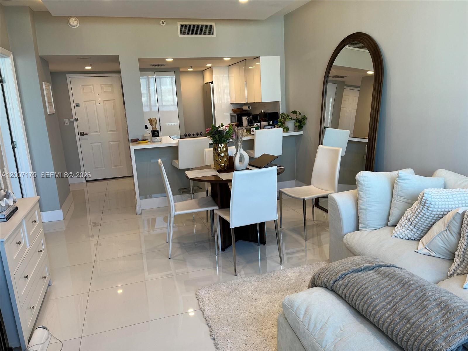540 Brickell Key Drive, Unit 1809 Miami, FL 33131 - Photo 13 of 25 a view of a livingroom with furniture and window