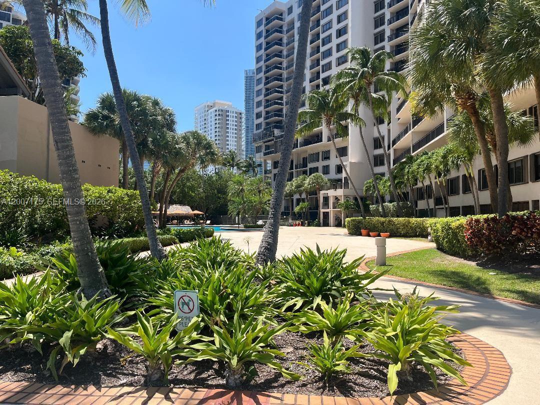540 Brickell Key Drive, Unit 1809 Miami, FL 33131 - Photo 25 of 25 a view of yard with swimming pool and trees
