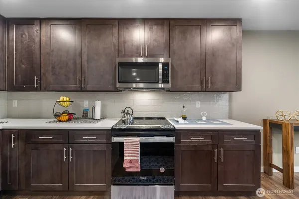 a kitchen with a sink and cabinets