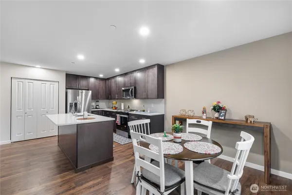 a kitchen with a table and chairs in it