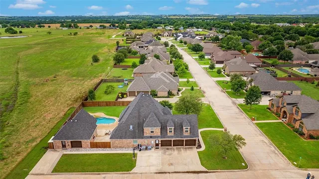 an aerial view of a house with a garden